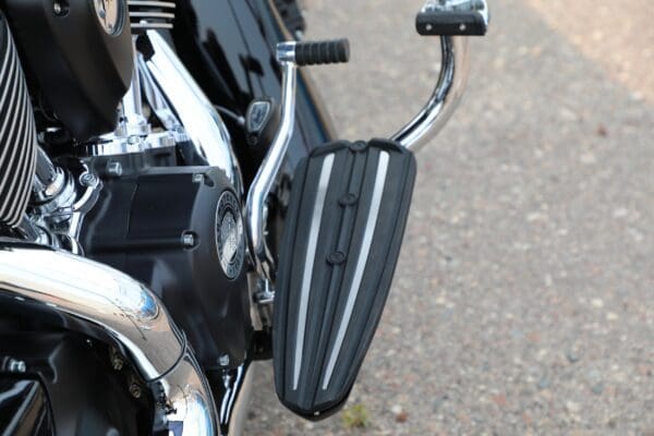 A close up of the side view mirror on a motorcycle.