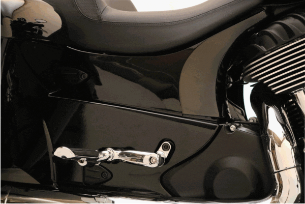 A close up of the front foot rest on a motorcycle.